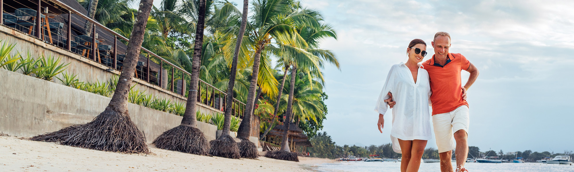 Couple walking along a beach